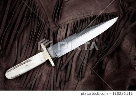 Old west bowie knife on leather jacket 118225111