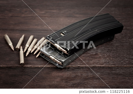 Ammunition with magazine on wooden table 118225116