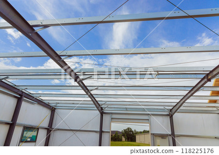 Metal frame to new barn is under construction with steel constructions Metal frame to new barn is under construction with steel constructions 118225176