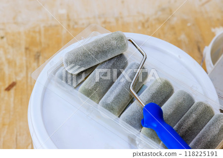 Rollers with handle are ready for painting walls 118225191
