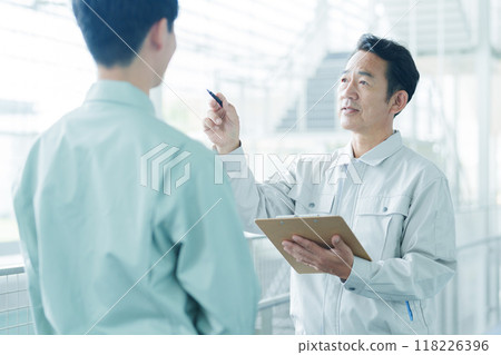 Engineers having a meeting on site Engineers having a meeting on site 118226396