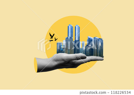 A hand holding a city skyline with flying birds A hand holding a city skyline with flying birds 118226534