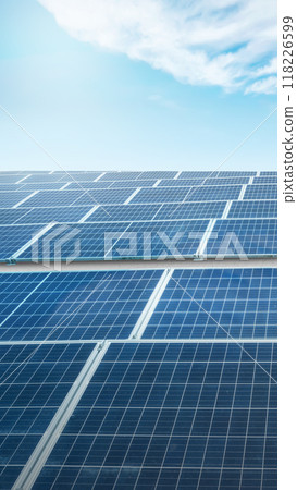 A solar panel is shown in the image, with the sun shining on it A solar panel is shown in the image, with the sun shining on it 118226599