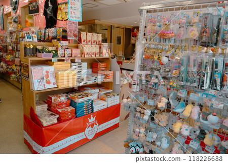 People walking along souvenirs  shop and food store near Dazaifu Tenmangu shrine entrance. : Many students visit the shrine to pray for success in their studies and 118226688