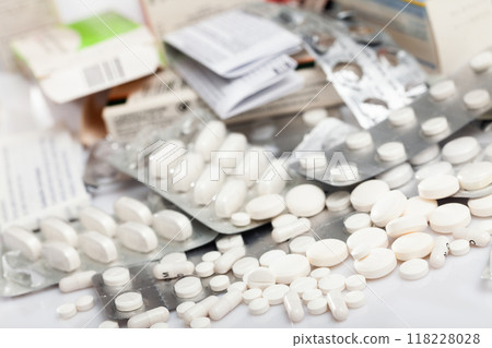 Many different pills and medical capsules close up 118228028