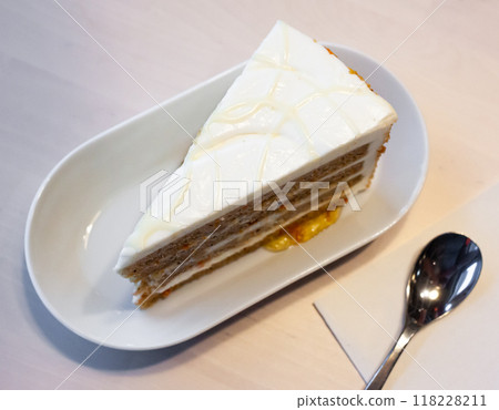 Slice of delicate carrot cake Slice of delicate carrot cake 118228211