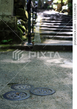 Round roof tiles buried in the approach to the shrine Round roof tiles buried in the approach to the shrine 118228629