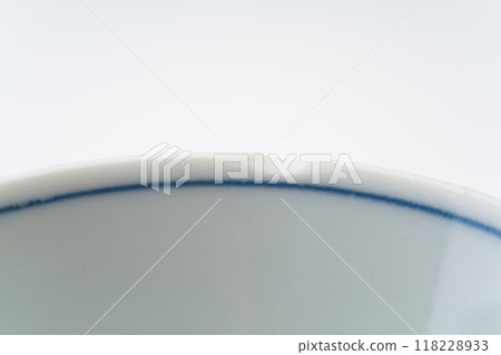 Close-up of a chipped edge of a teacup 118228933