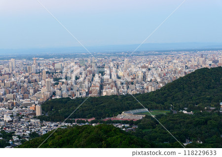 Sapporo city at dusk as seen from Mt. Okura in summer Sapporo city at dusk as seen from Mt. Okura in summer 118229633