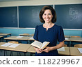 A professional female teacher standing in the classroom holding a book Generated by AI 118229967