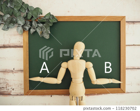 The letters A and B on the blackboard. Compare, choose, which one 118230702