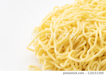Close-up of raw medium-thick curly noodles 118231309