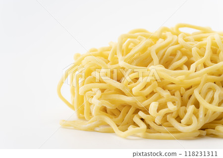 Close-up of raw medium-thick curly noodles 118231311