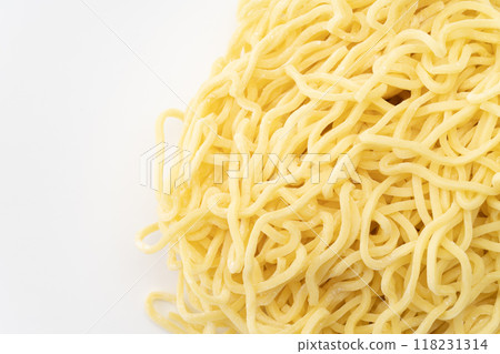 Close-up of raw medium-thick curly noodles 118231314