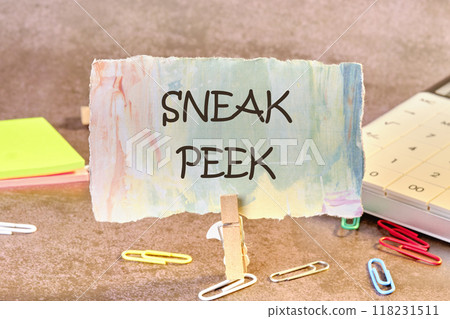 Conceptual sneak peek symbol. Copy space. SNEAK PEEK words written on a piece of paper in a clothespin 118231511