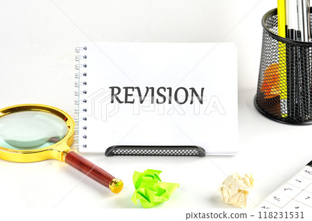 REVISION written in a notebook on a white background 118231531