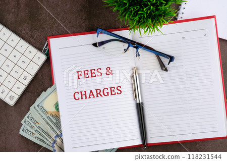 Business concept. FEES and CHARGES words there is an important text in the business book Business concept. FEES and CHARGES words there is an important text in the business book 118231544