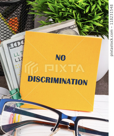Conceptual no discrimination symbol. Copy space. No discrimination words written on a yellow sticker, vertical concept photo Conceptual no discrimination symbol. Copy space. No discrimination words written on a yellow sticker, vertical concept photo 118231548