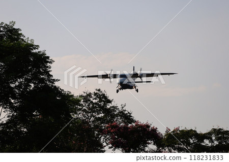 (Chofu Airport, Tokyo) A propeller passenger plane lands between the trees in a park. 118231833