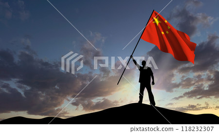 The silhouette of a man, standing on a small mountain, waves the Chinese flag, in the background a cloudy sky at dawn The silhouette of a man, standing on a small mountain, waves the Chinese flag, in the background a cloudy sky at dawn 118232307