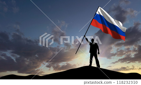 The silhouette of a man, standing on a small mountain, waves the Russian flag, in the background a cloudy sky at dawn The silhouette of a man, standing on a small mountain, waves the Russian flag, in the background a cloudy sky at dawn 118232310
