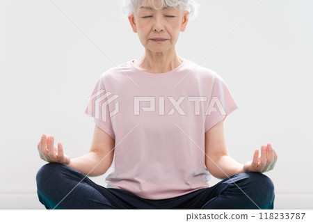 Senior woman doing yoga poses Healthy image 118233787