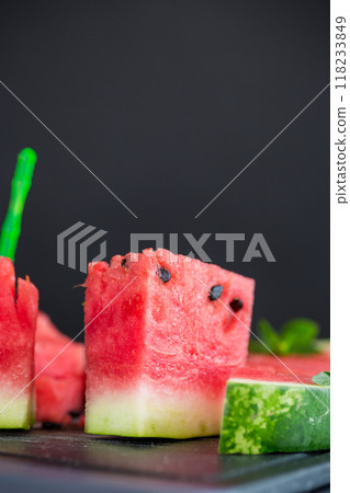 pieces of ripe red watermelon, close-up, on a board 118233849