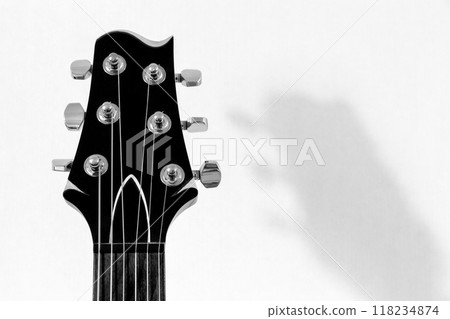 Guitar against the wall 118234874
