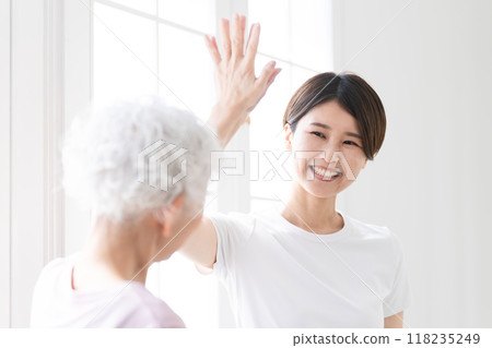 Young and senior women doing yoga, healthy image Young and senior women doing yoga, healthy image 118235249