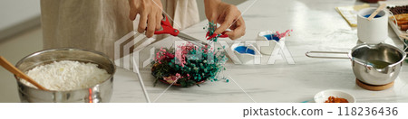 Woman Decorating Candles With Flowers 118236436