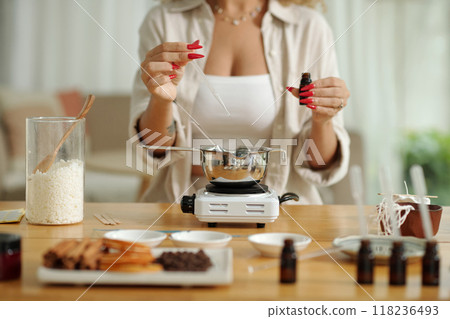 Woman Making Candles With Aroma Oil 118236493