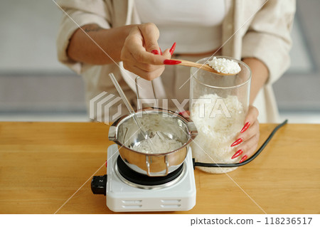 Woman Melting Wax For Candles Woman Melting Wax For Candles 118236517