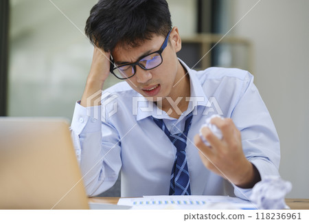Frustrated Businessman Yelling at Laptop in Anger Frustrated Businessman Yelling at Laptop in Anger 118236961