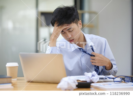 Stressed Businessman or Office Worker Facing Overwork and Pressure Stressed Businessman or Office Worker Facing Overwork and Pressure 118236990