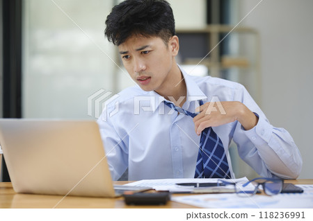 Stressed Businessman or Office Worker Facing Overwork and Pressure Stressed Businessman or Office Worker Facing Overwork and Pressure 118236991