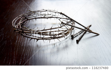 Rusty nails and a wreath of thorns at the cross 118237480