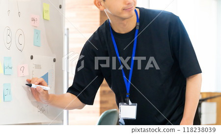 Male businessman having a meeting using a whiteboard 118238039