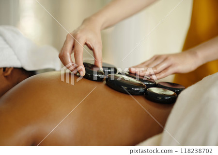 Experiencing Relaxation Through Hot Stone Massage Experiencing Relaxation Through Hot Stone Massage 118238702