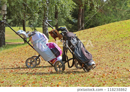 Golf equipment, clubs and bags at golf club in autumn. Background for design with copy space. Nature and sport. Modern lifestyle in nature.  118238862