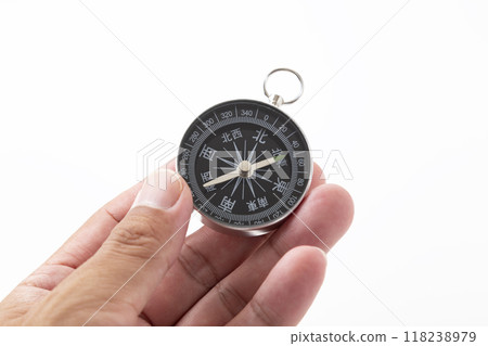 Male hand holding a compass Male hand holding a compass 118238979
