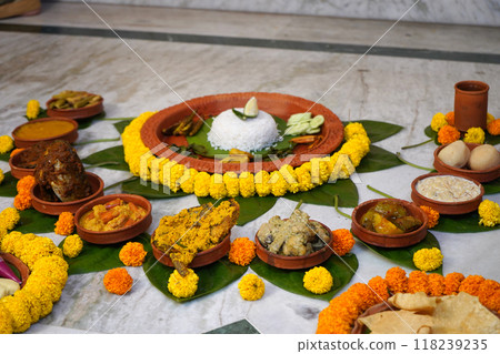 Different types of bengali dishes served in earthenware Different types of bengali dishes served in earthenware 118239235