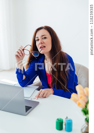 Business woman learning at work in office on online laptop Business woman learning at work in office on online laptop 118239385