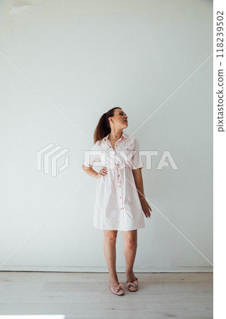 Beautiful woman 40 years old in dress posing Beautiful woman 40 years old in dress posing 118239502