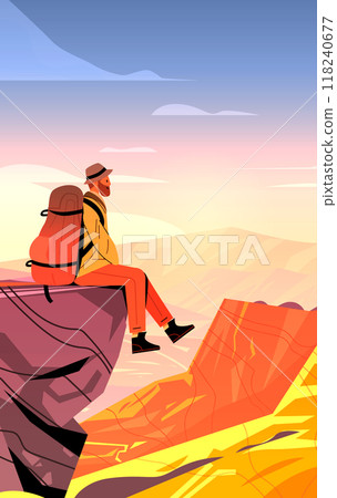Hiker with backpack sitting on cliff edge overlooking canyon at sunset colorful landscape adventure travel outdoor activity 118240677