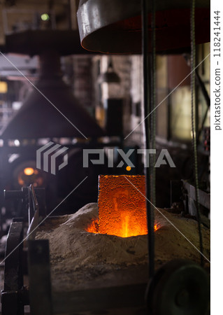 Ferrous metal billet is melted in an induction furnace closeup 118241444
