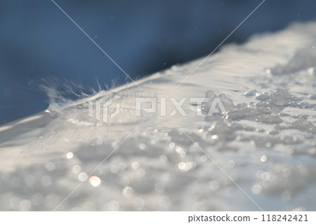 Spring drops and melting snow on the windowsill outside the window, closeup. Spring drops and melting snow on the windowsill outside the window, closeup. Spring drops and melting snow on the windowsill outside the window, closeup. Spring drops and melting snow on the windowsill outside the window, closeup. 118242421