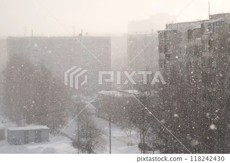 Urban landscape in blue colors in heavy snowfall, blizzard, snowstorm on street. Urban landscape in blue colors in heavy snowfall, blizzard, snowstorm on street. 118242430