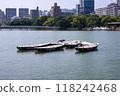 A bird spreading its wings and taking off from a boat 118242468
