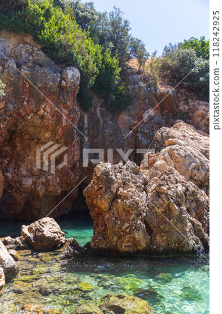Coastal rocks of Kalkan, Turkey. Summer landscape, vertical photo 118242925