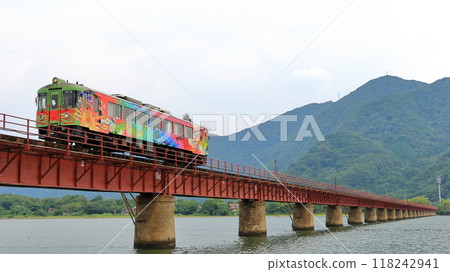 Kyoto Tango Railway KTR700 series wrapped train crosses the Yura River Bridge 118242941